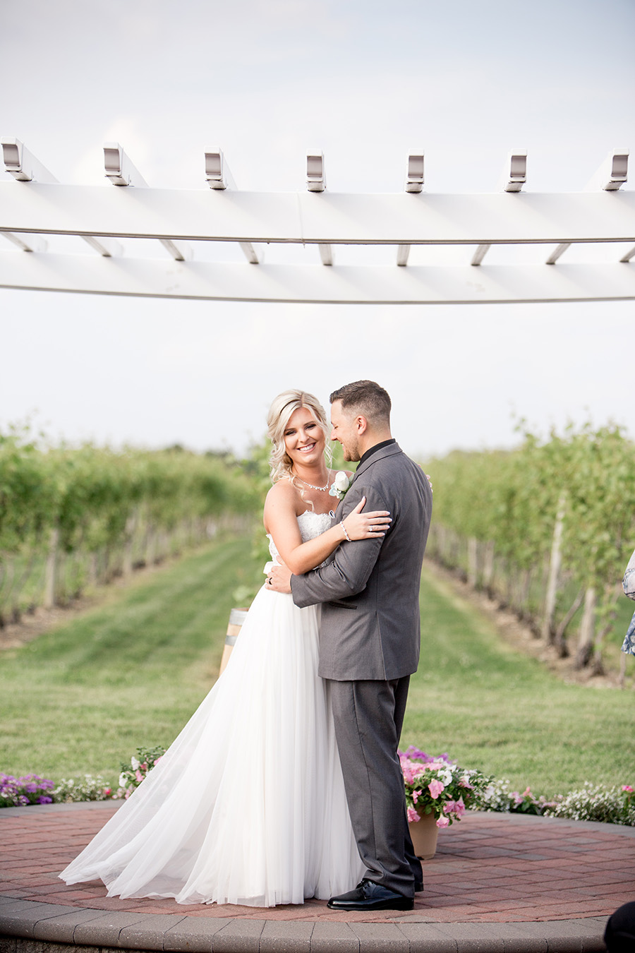 bride and groom after outdoor wedding at tomasello winery