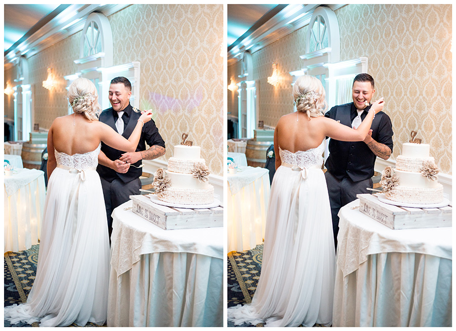 bride and groom share a slice of cake at the reception