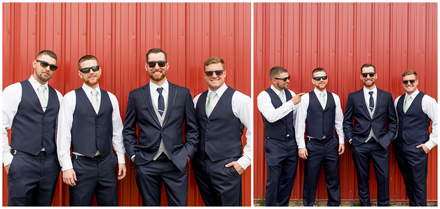 groomsmen pose outside the red barn