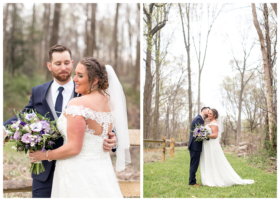 couple takes wedding portraits in field behind barn