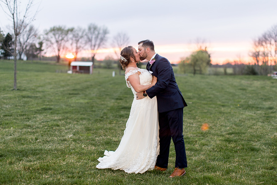 bride and groom pose for sunset wedding portraits at Warner Road Farm