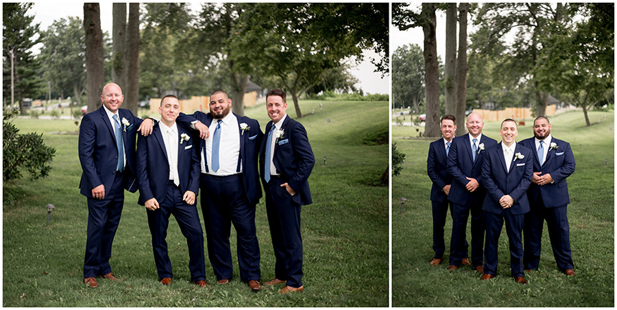 groom and groomsmen in navy suits with light blue accents