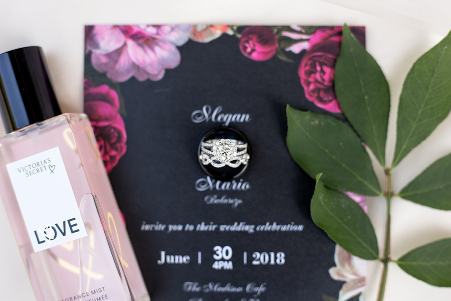 wedding rings with floral invitation