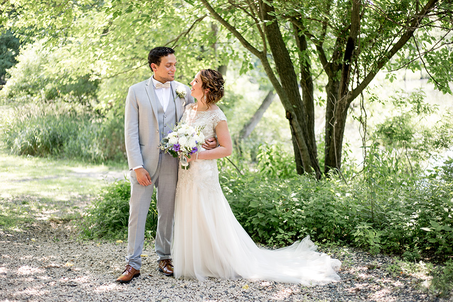 bride and groom in rustic woodland setting
