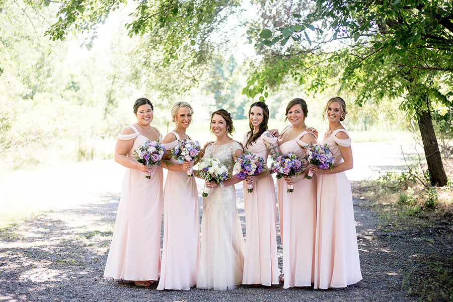 pale pink dresses and purple flowers