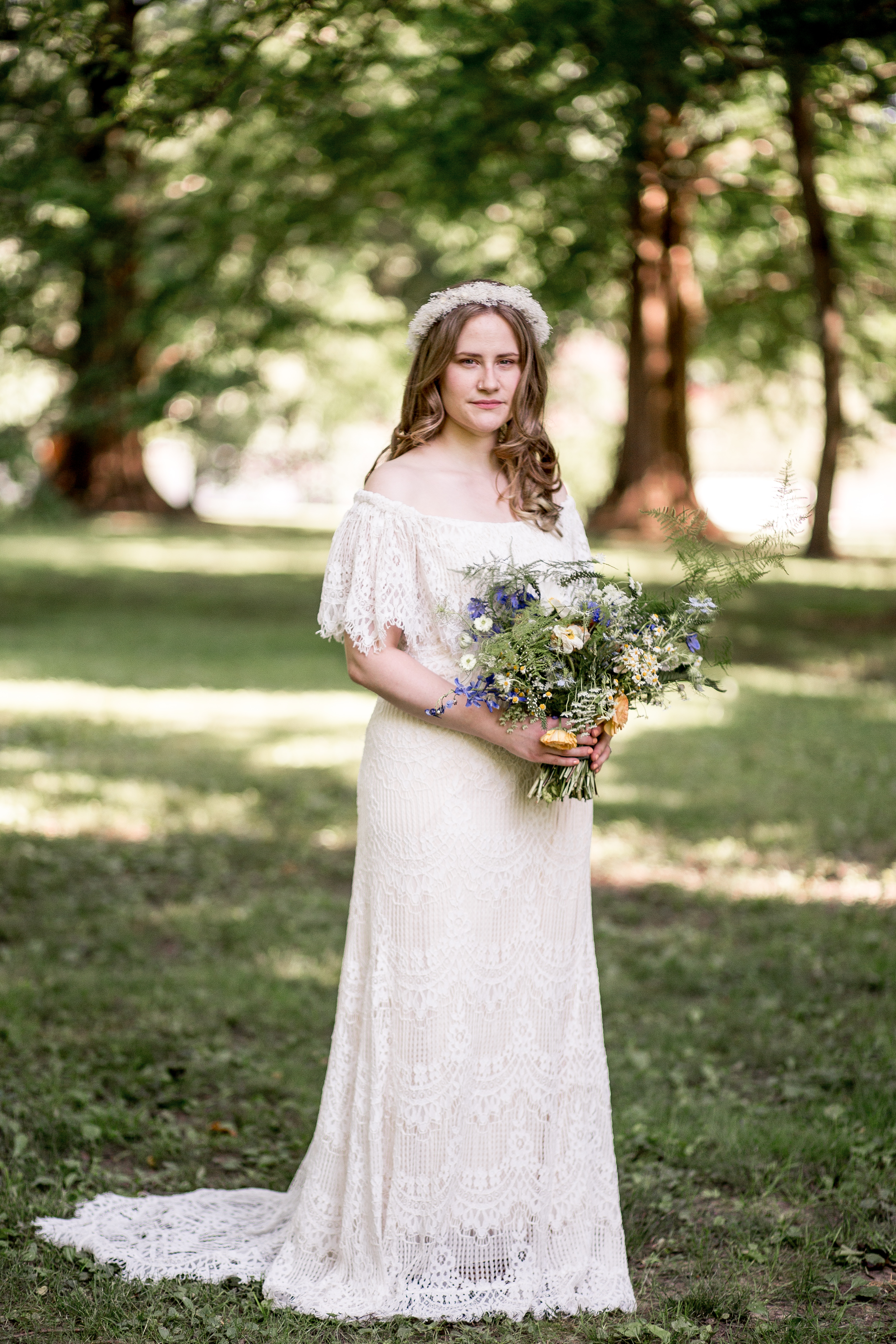 bohemian bride with her wildflower bouquet