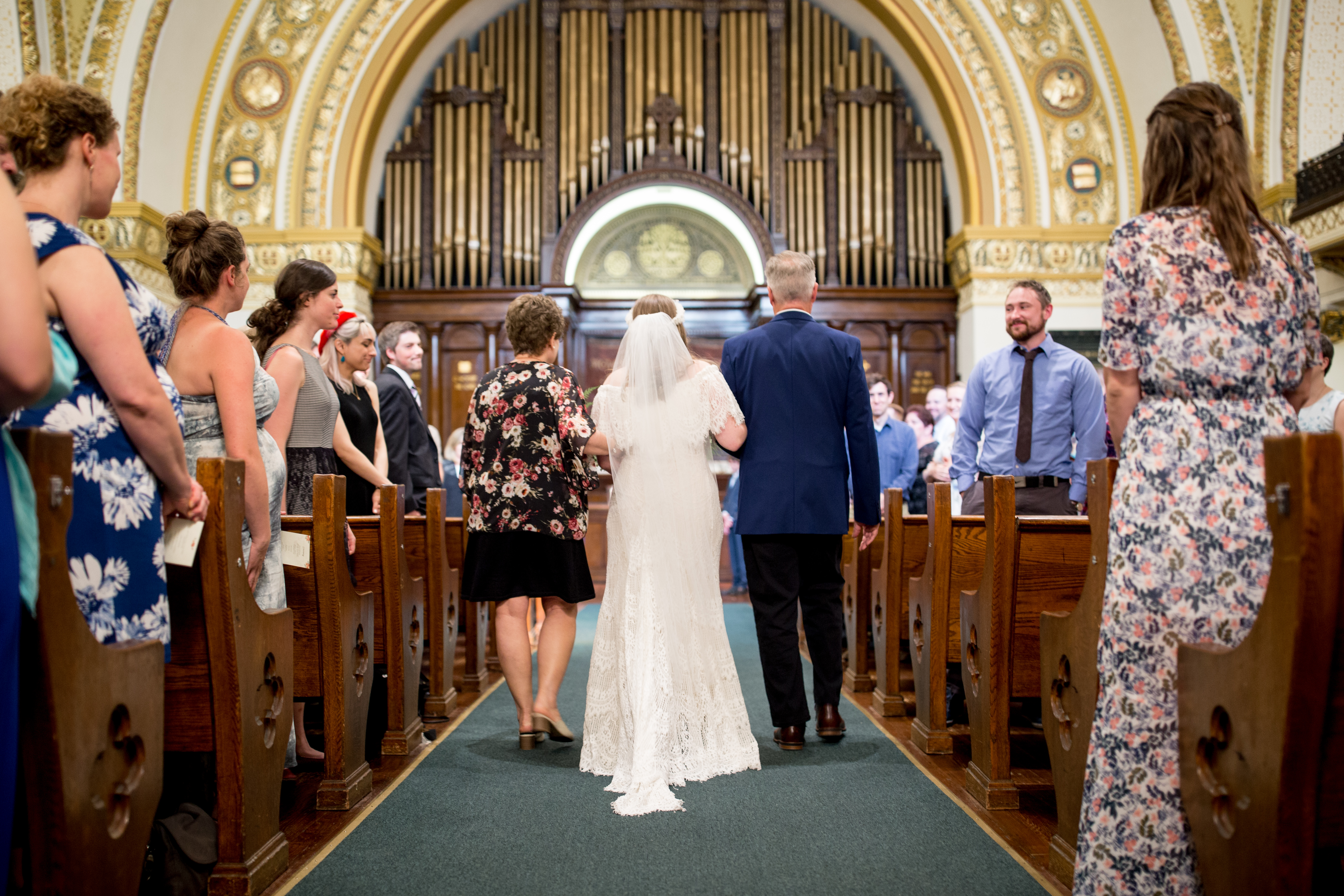 bride walks down the aisle at liberti church
