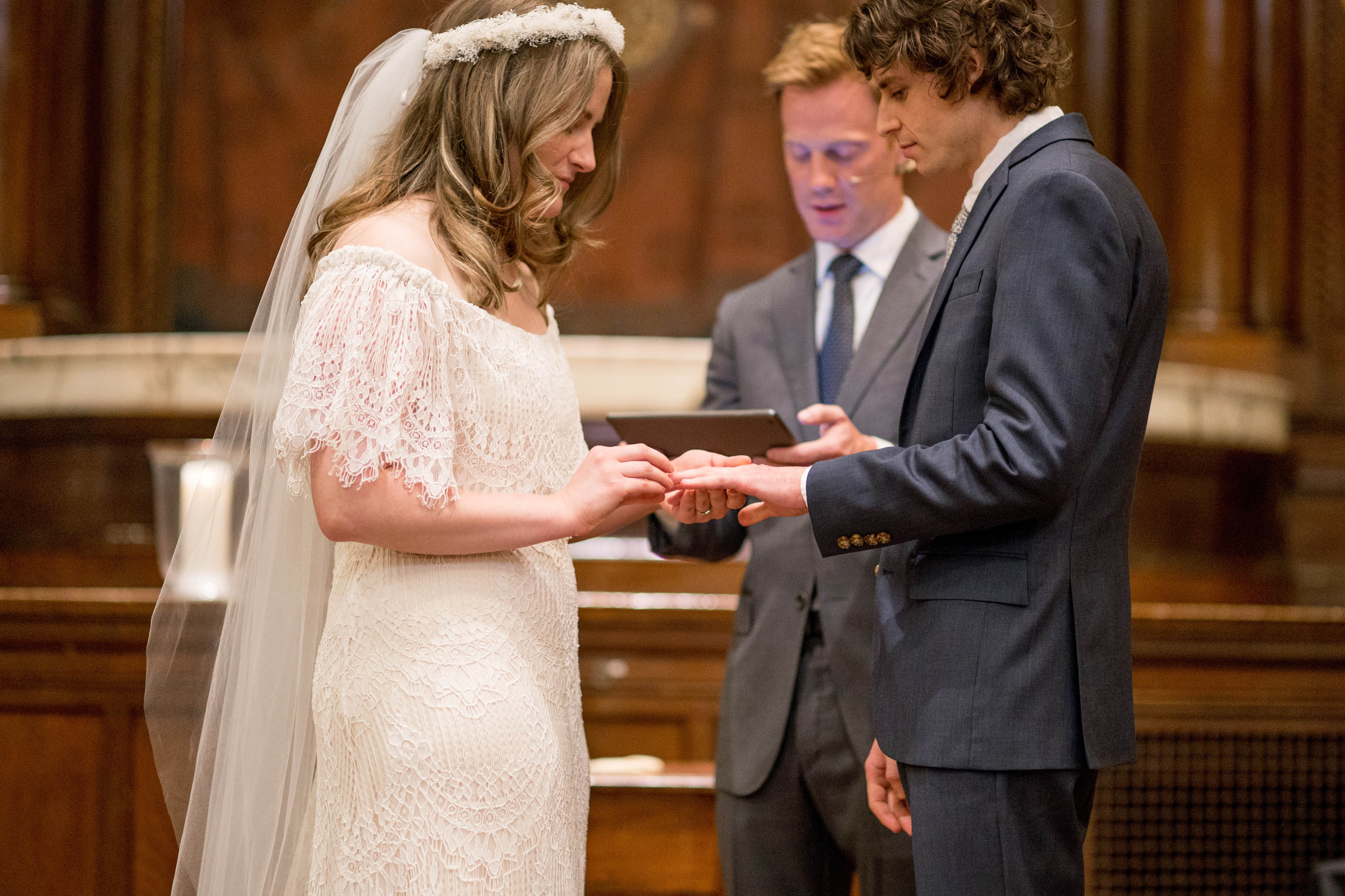 bride and groom gives each other rings in liberti church 