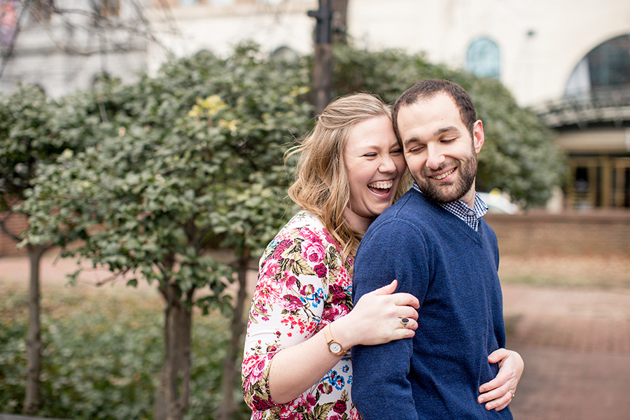 couple laughs together at their historic philadelphia engagement session