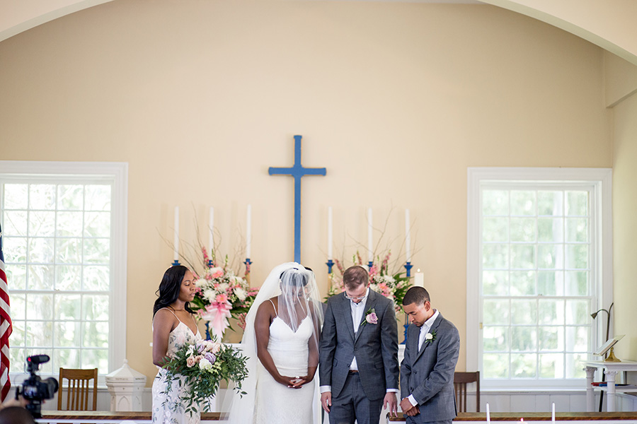 prayer at the end of the wedding ceremony in allaire chapel