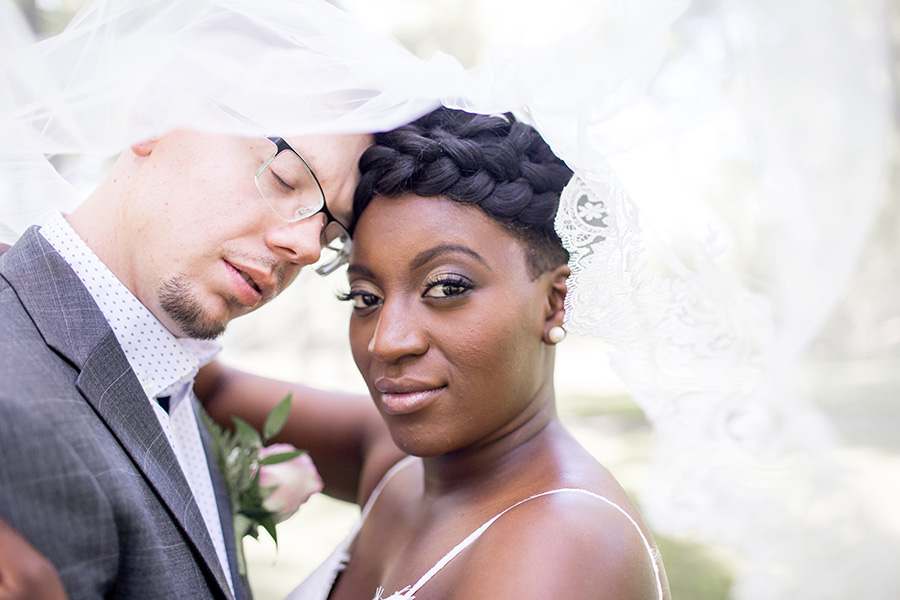 dramatic wedding portraits of the bride and groom at allaire chapel
