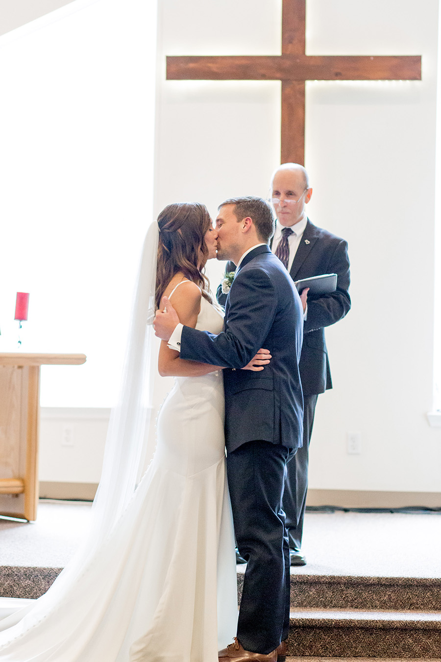 bride and groom's first kiss at their intimate wedding in south jersey