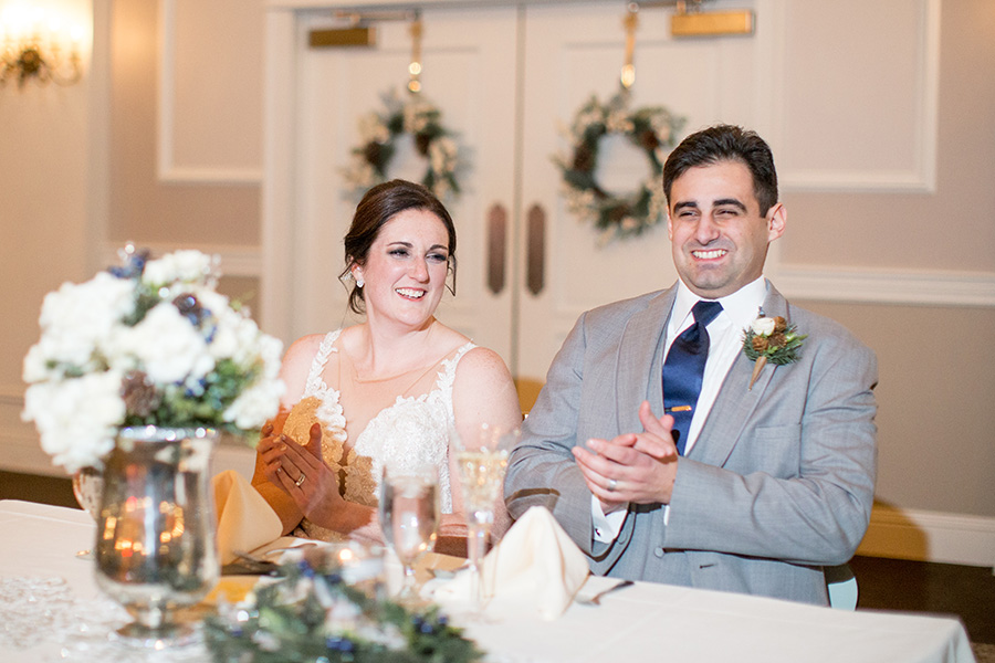 bride and groom listens to wedding toasts at eastlyn golf course