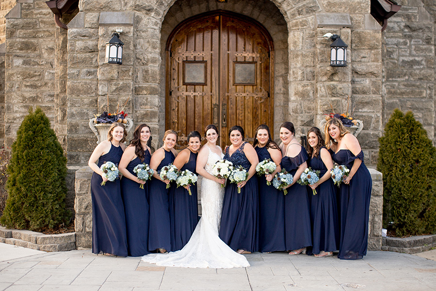 bridesmaids dressed in navy and carrying winter bouquets for eastlyn golf course wedding