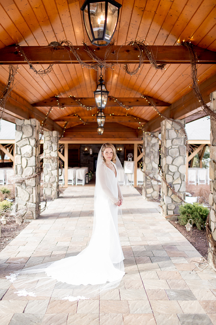 bride stands outside ceremony space at lawnhaven venue