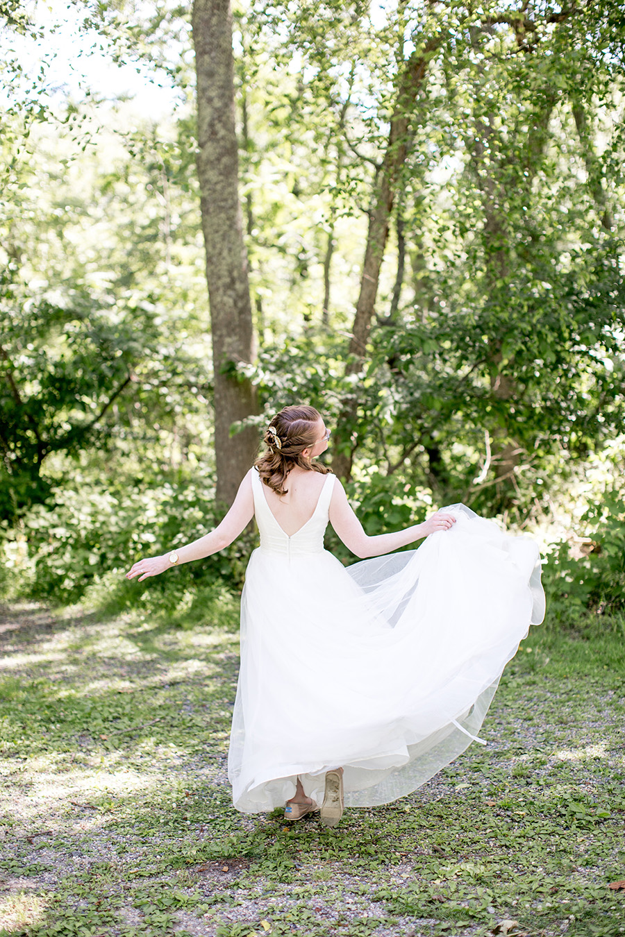 bride in her wedding dress at allaire state park