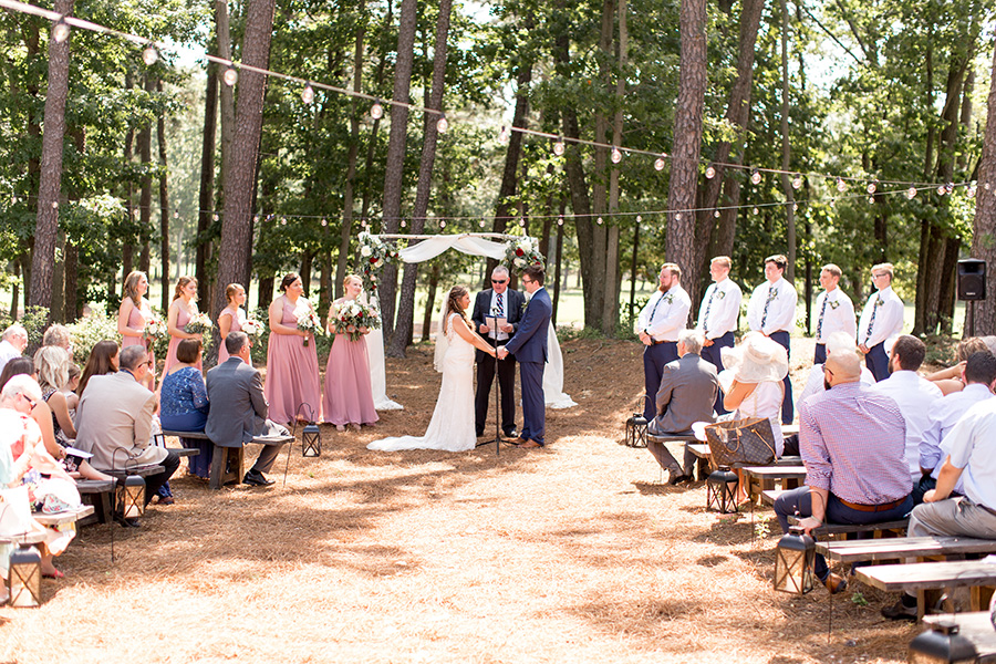 wedding ceremony outside at the timbers at running deer