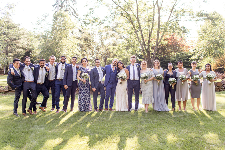 large mix-matched wedding party at stone house at stirling ridge