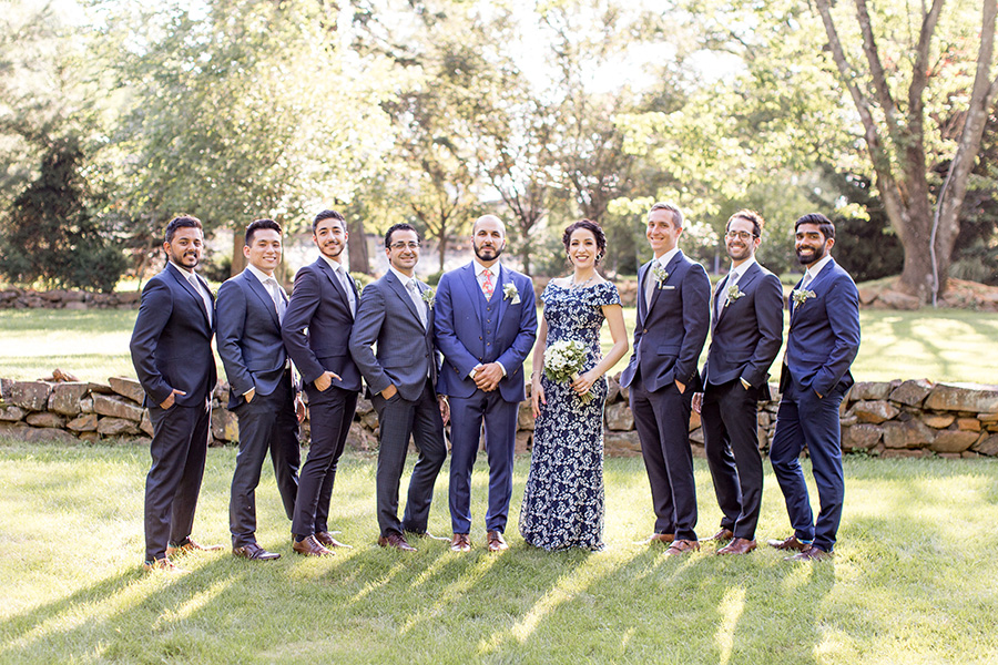 groom and his groomsmen in different gray suits
