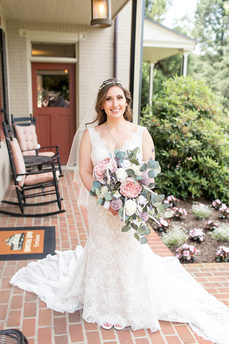 bride outside the farmhouse at ironstone ranch