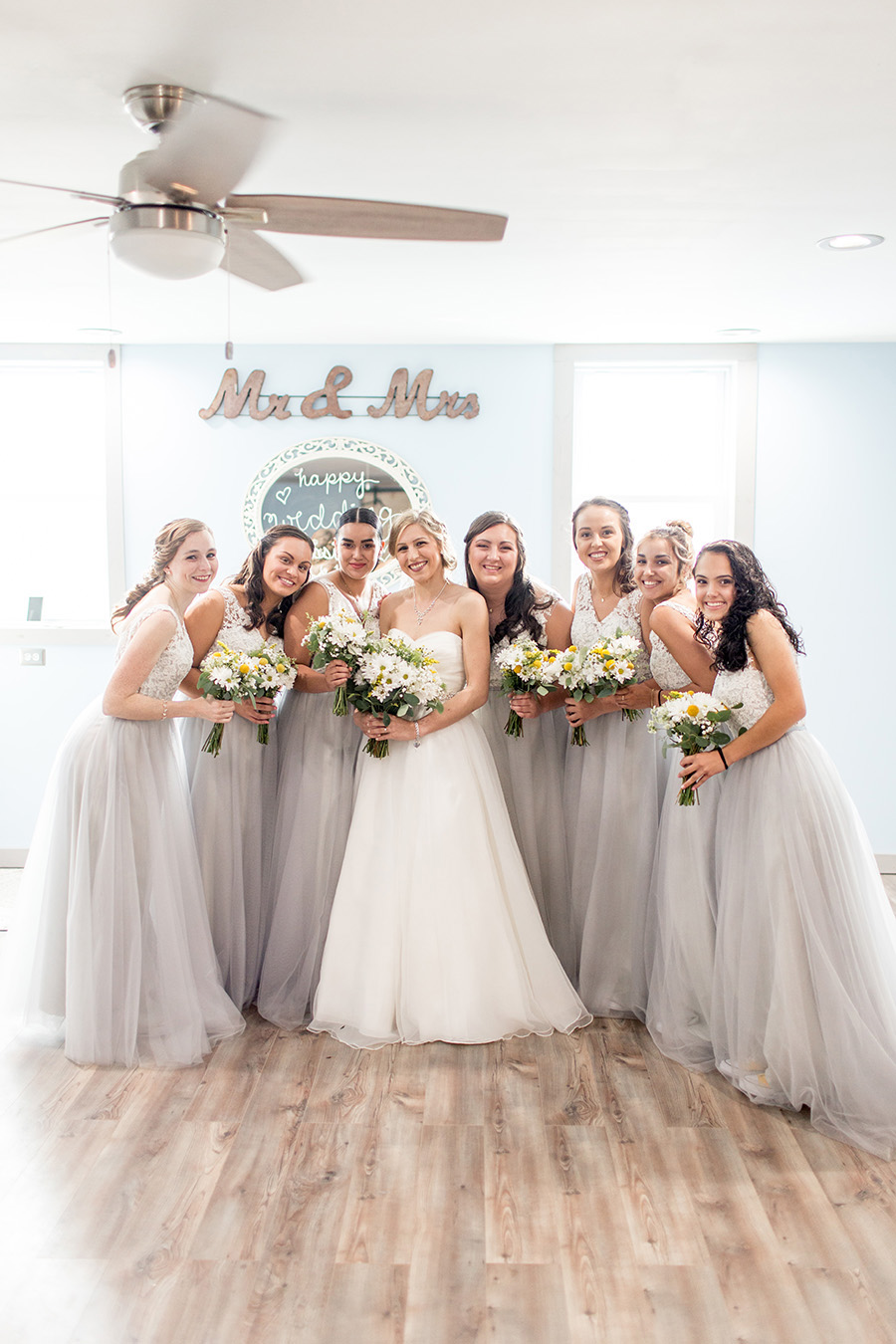 bridesmaids in full length gray dresses