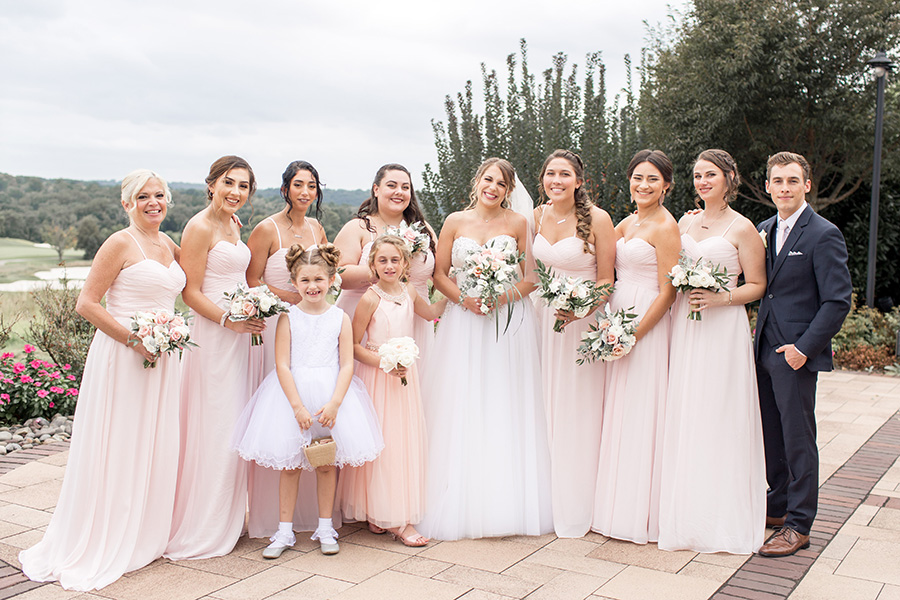 bride and bridesmaids on patio at chubb hotel
