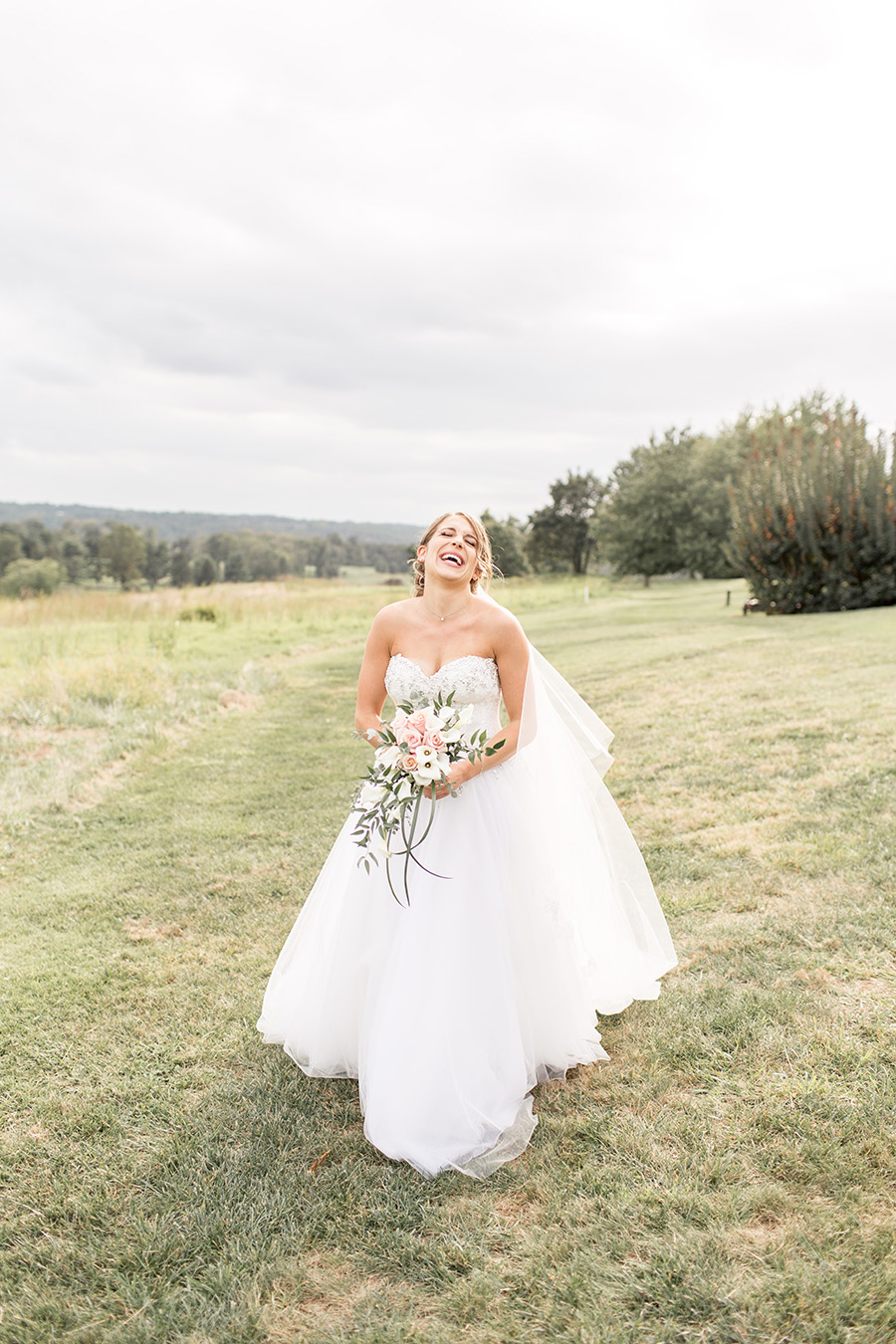 bride laughing on her wedding day