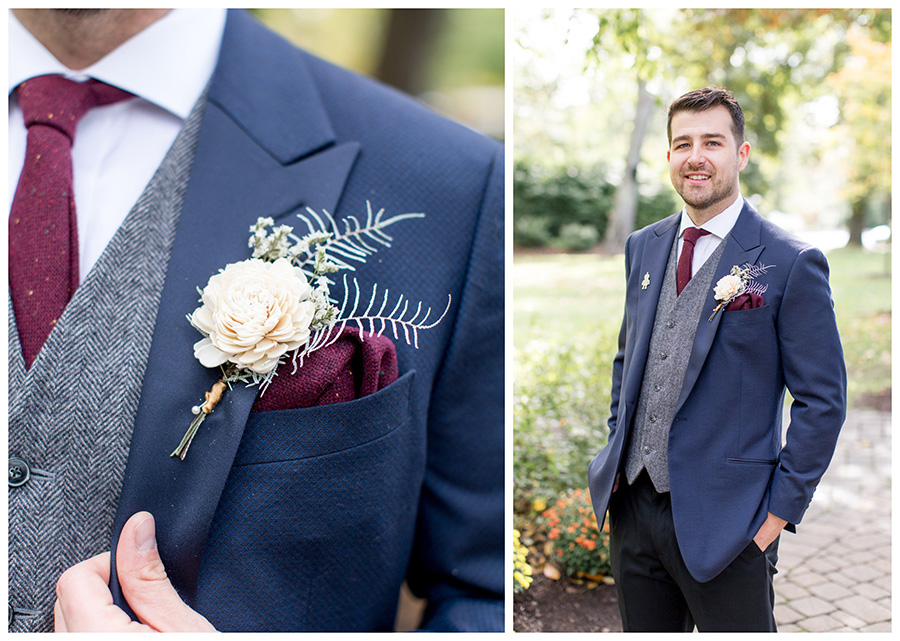 Groom's wooden flower boutonniere and maroon tie
