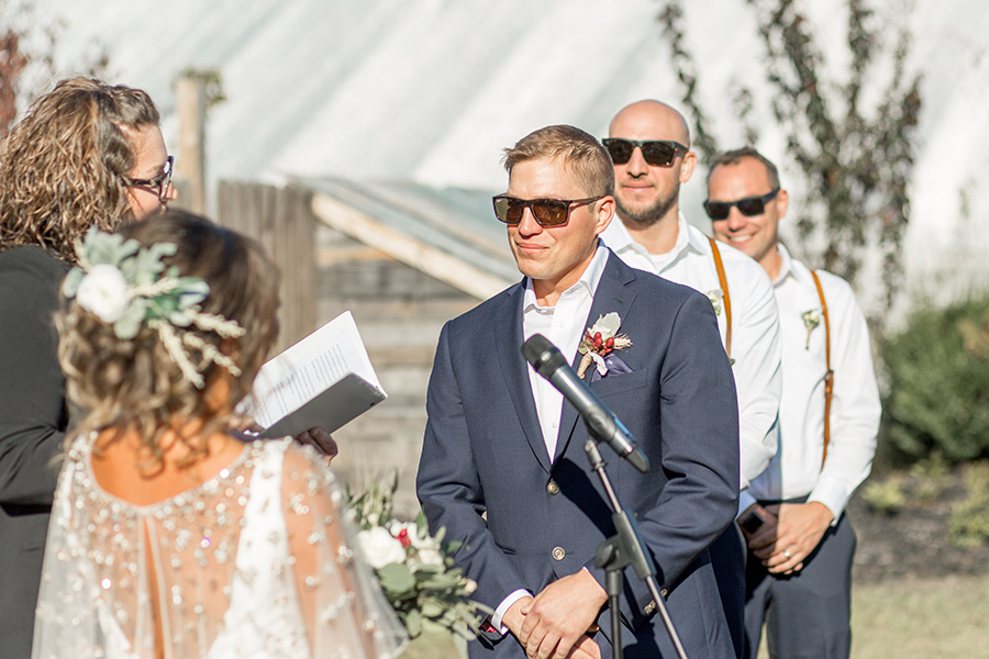 Groom exchanges vows at wedding ceremony