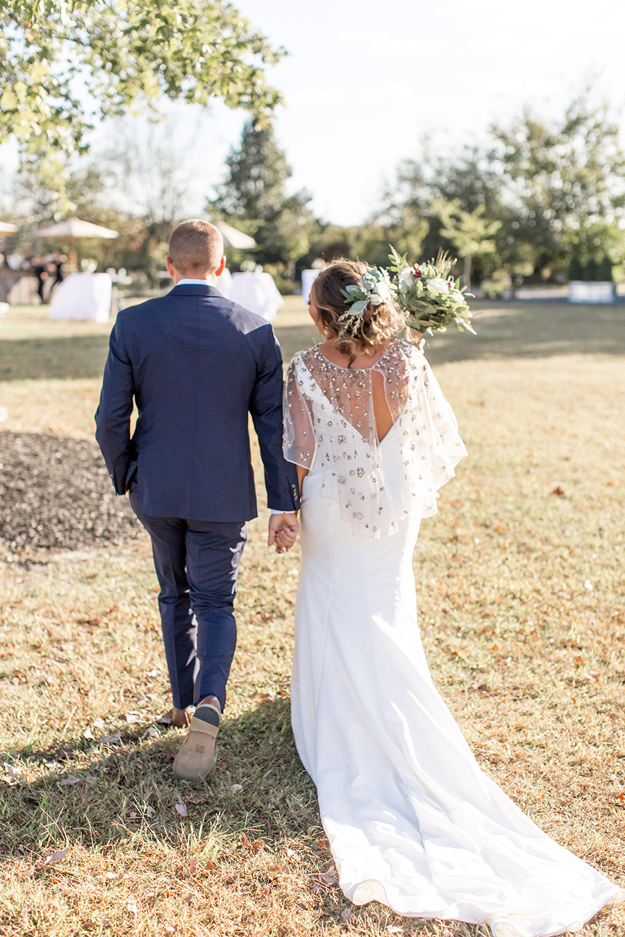 Bride and groom walk together after wedding ceremony