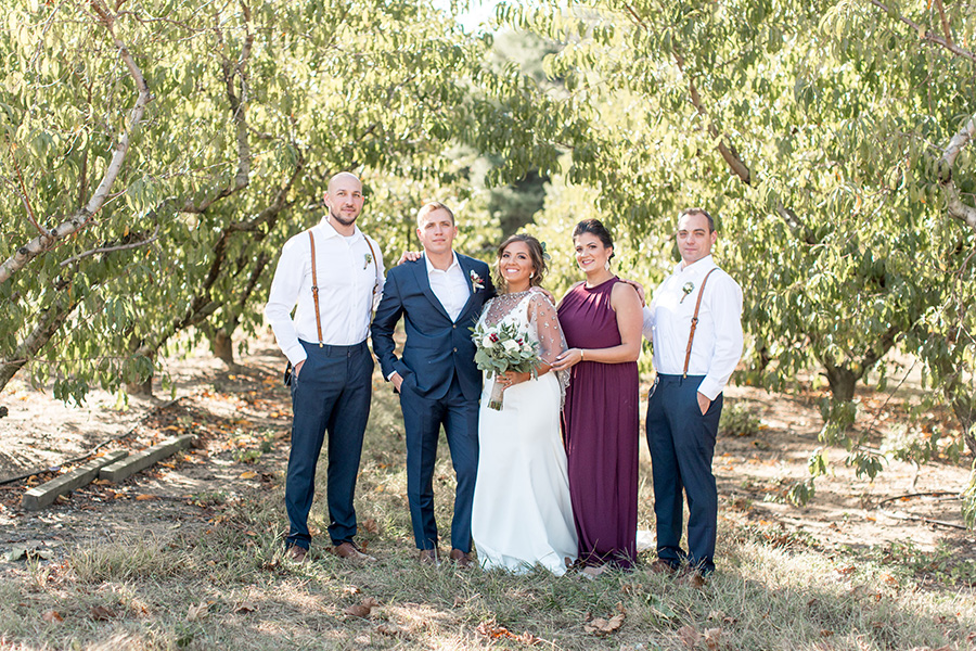 Wedding party portraits in the orchard at Bast Brothers
