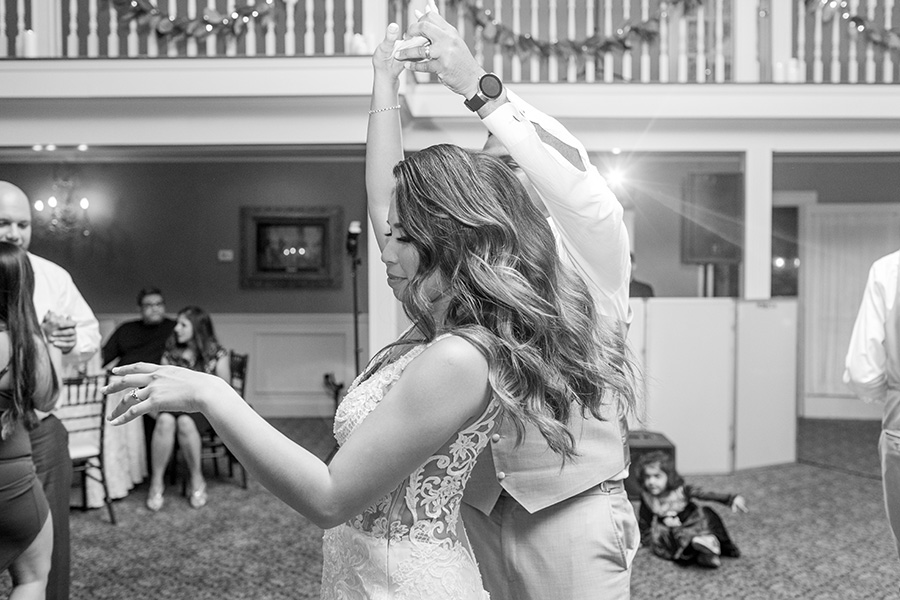 bride does a twirl at wedding reception 