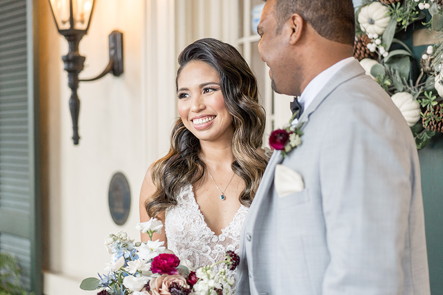 Bride smiles with her groom