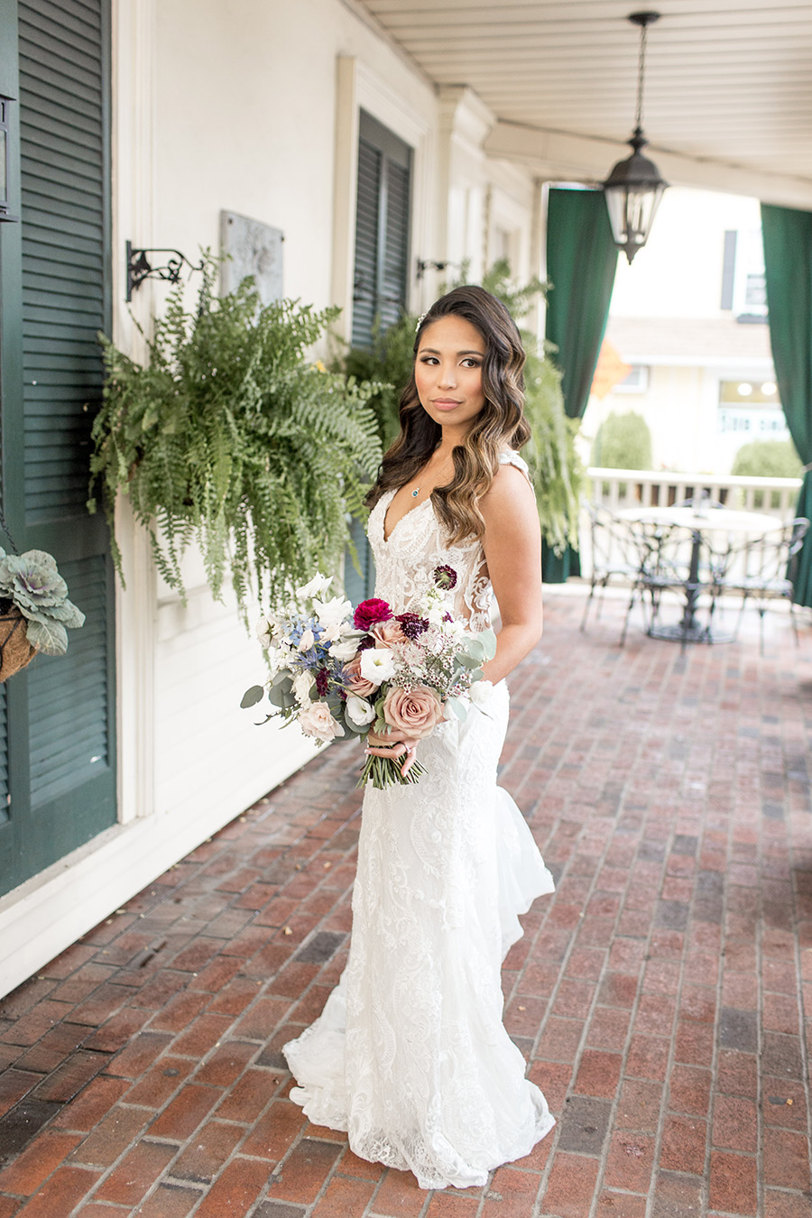 Bride in lace wedding gown with hollywood waves