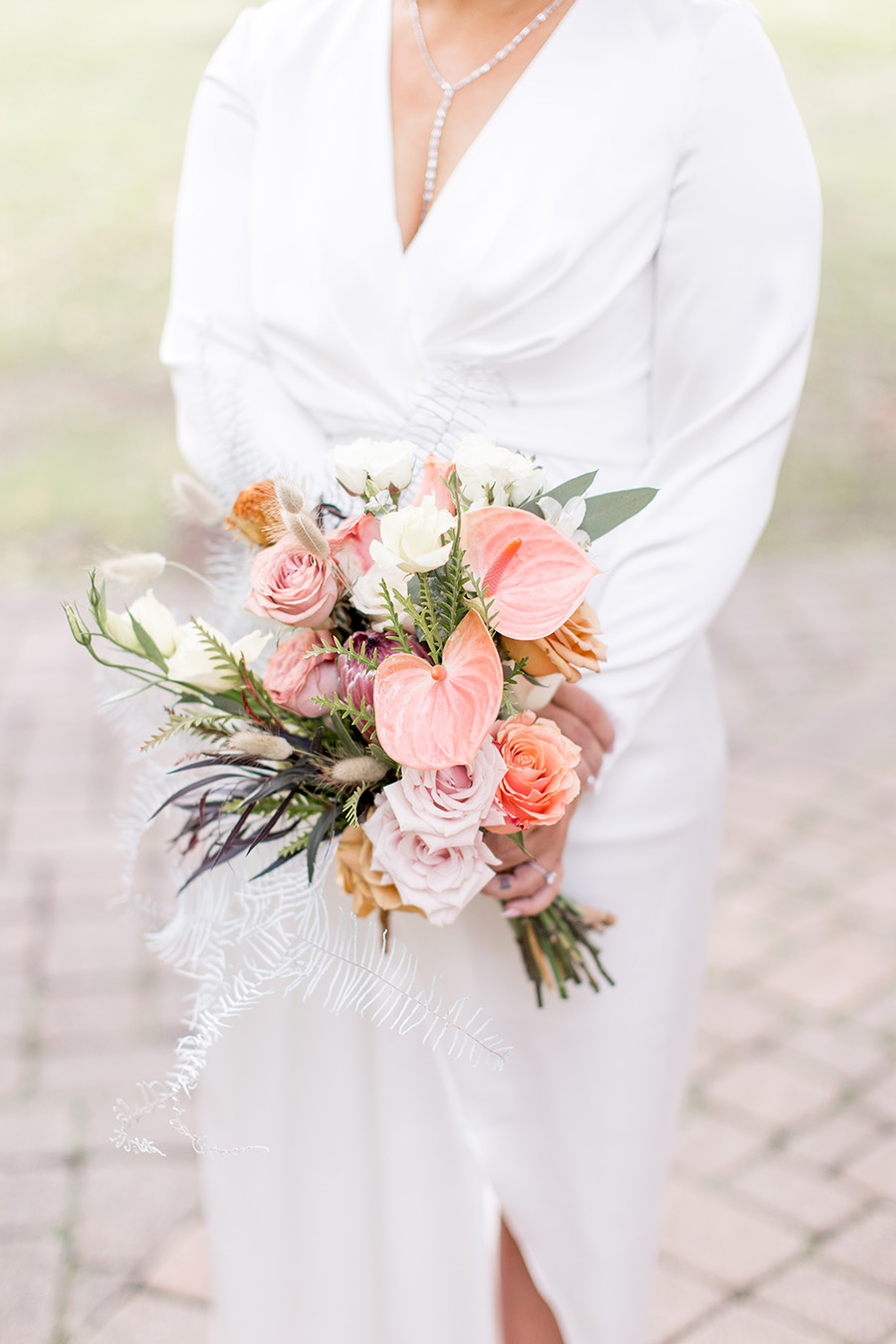Fall wedding bouquet with protea and calla lilies