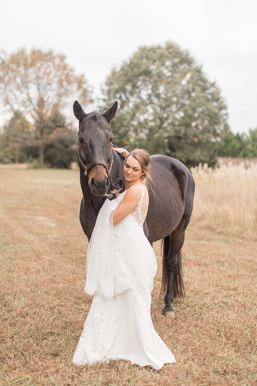 bride and her horse on her wedding day at Eagle Manor