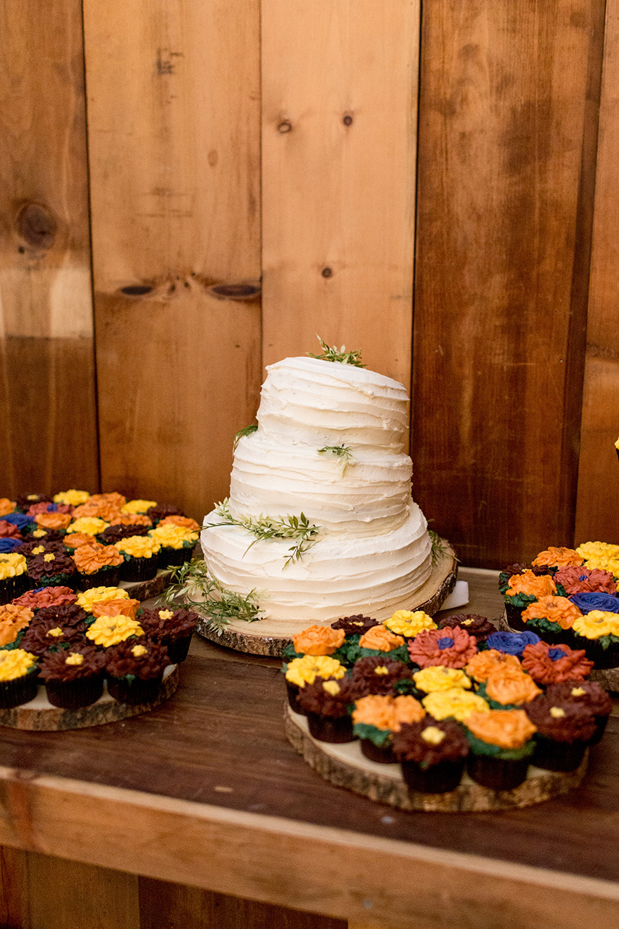 homemade wedding cake and sunflower cupcakes