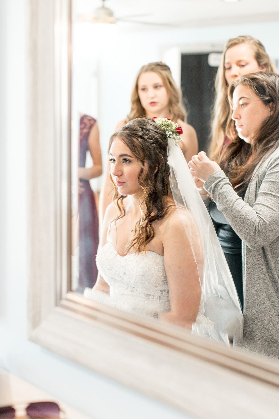 bride getting finishing touches done