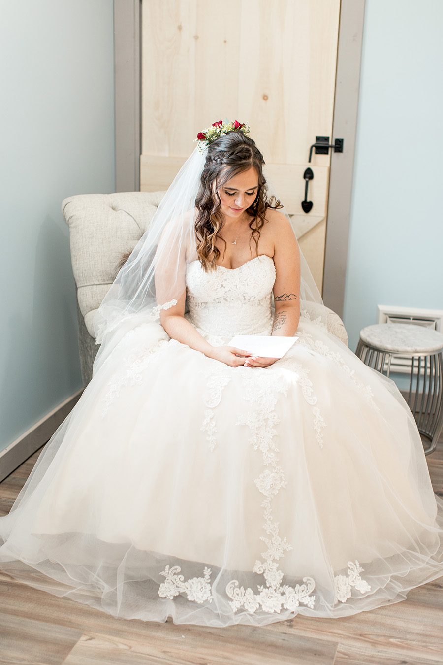 bride reading a letter to her groom on her wedding day