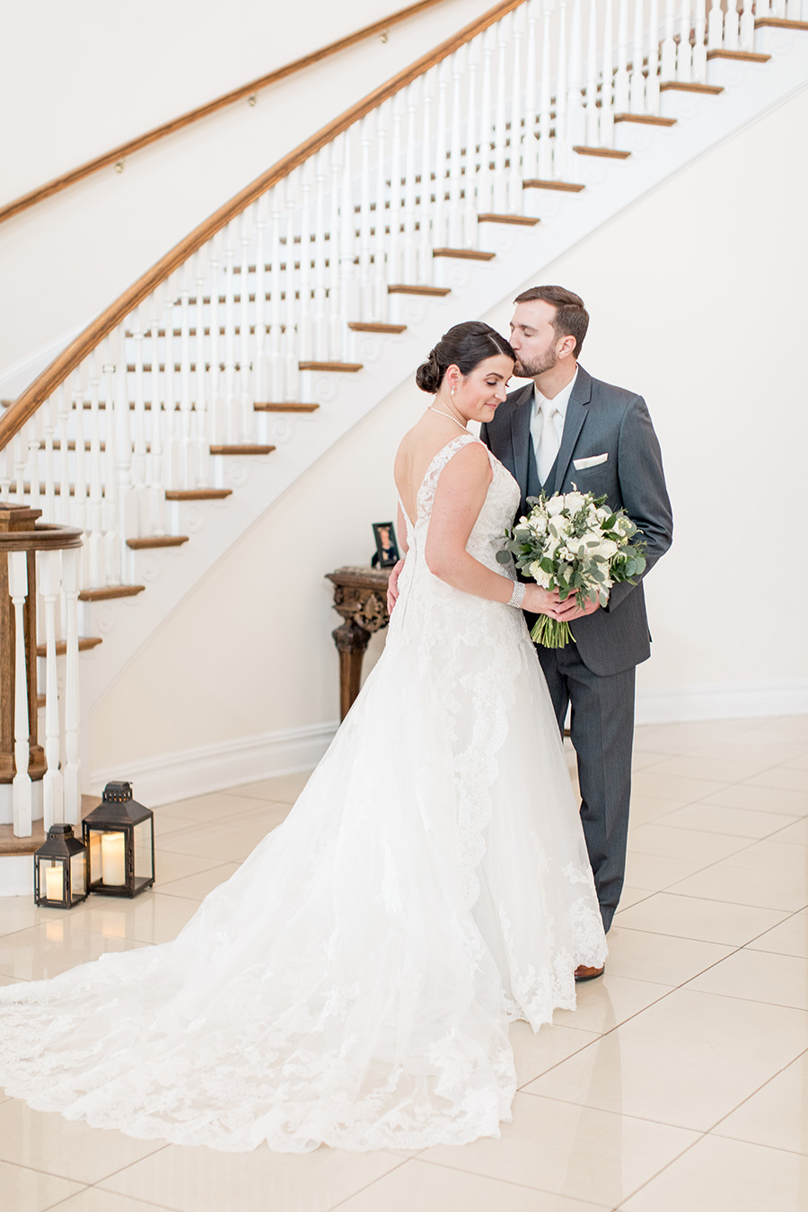bride and groom by the staircase