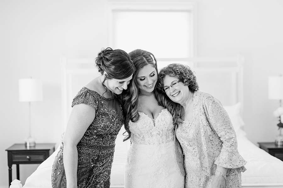bride with her mom and grandmom before the wedding