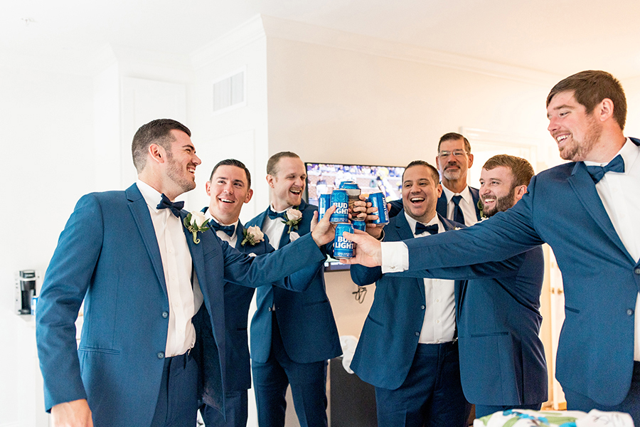 groomsmen cheers the groom before the wedding