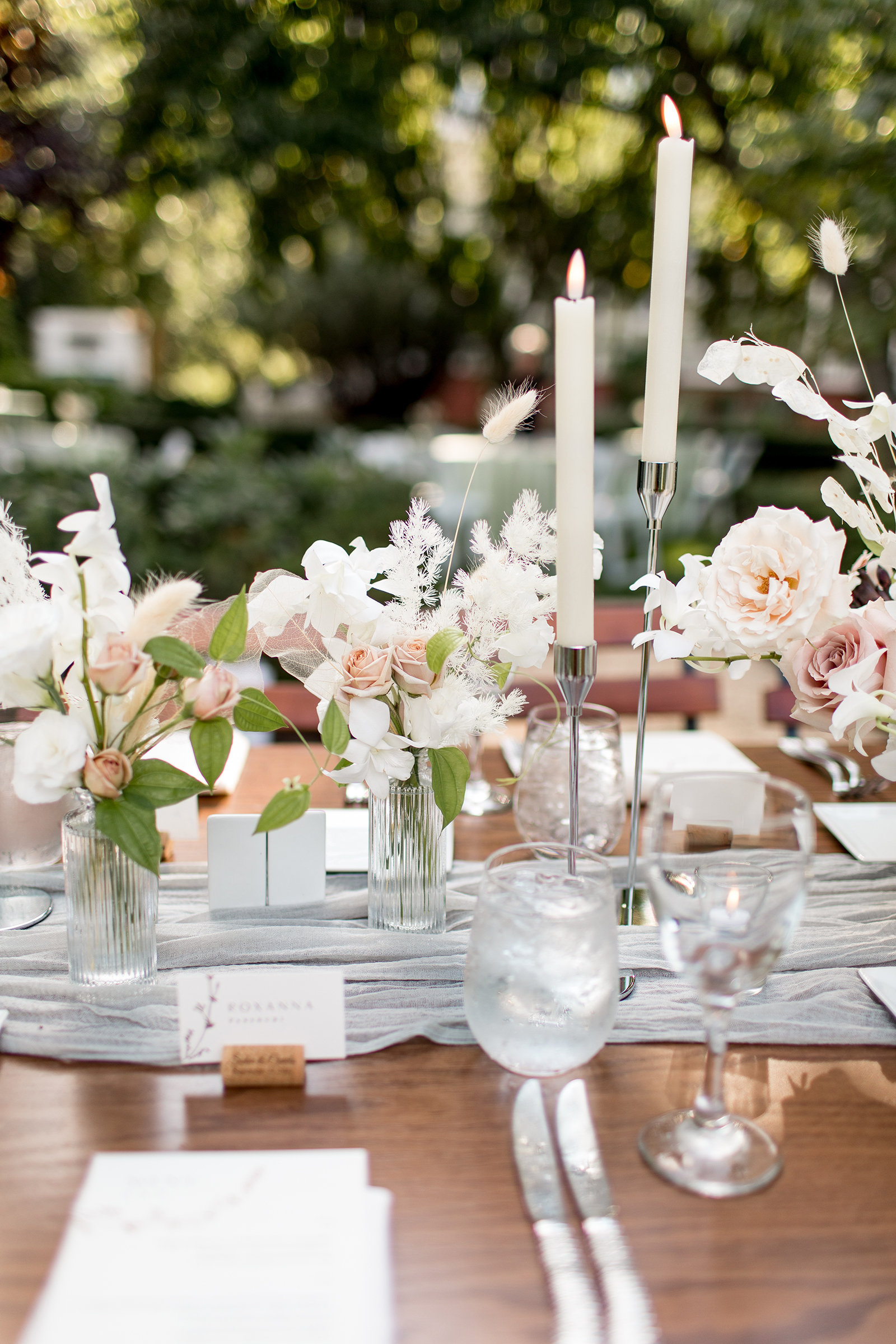 blush and neutrals floral centerpieces in bud vases